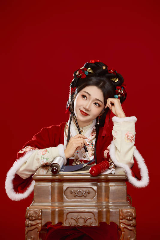 红色背景下身穿喜庆汉服认真学习的中国美女