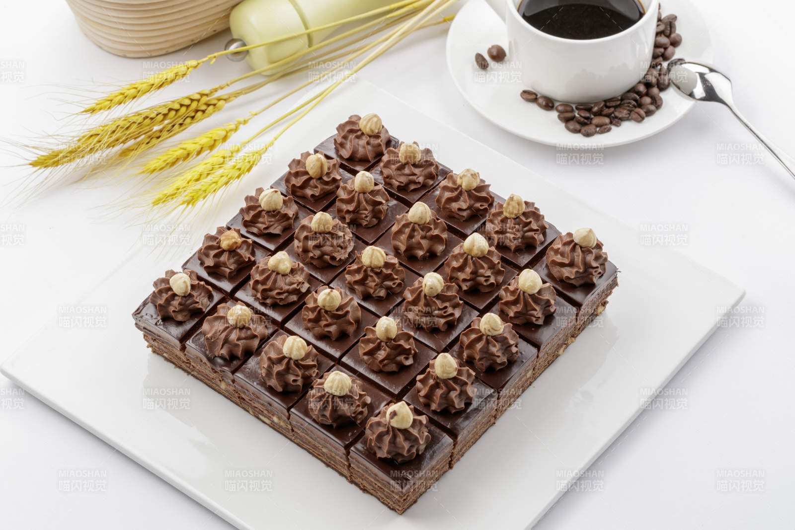 坚果巧克力慕斯蛋糕摆放在白色背景上