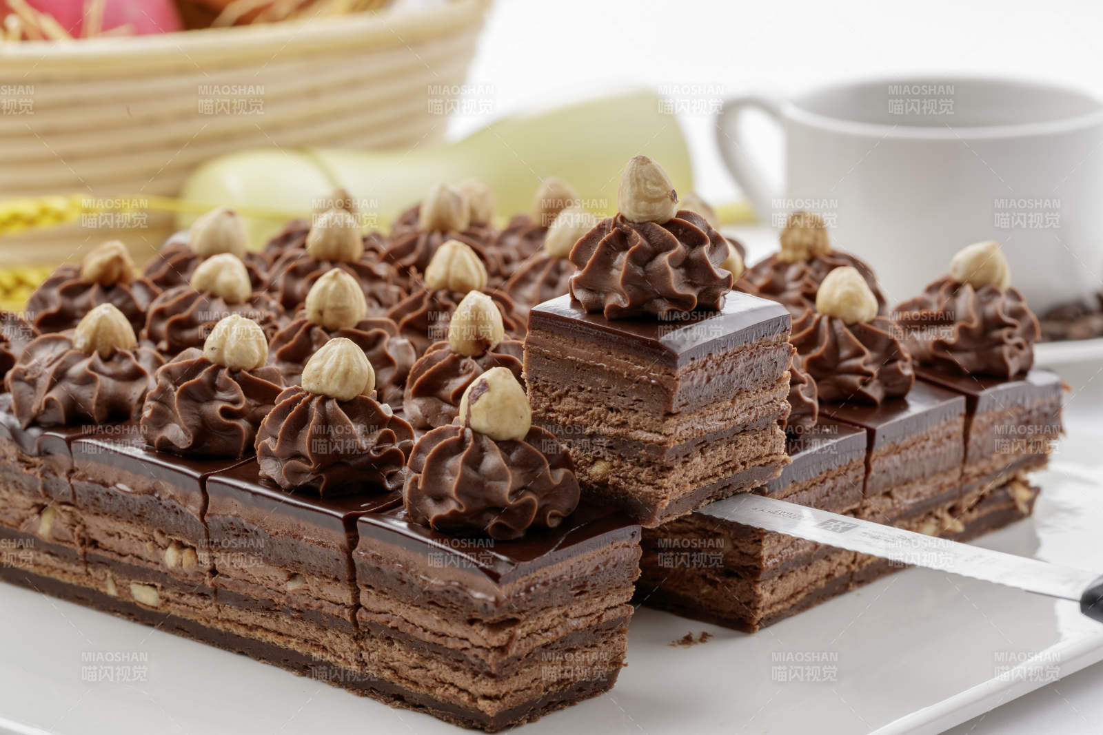坚果巧克力慕斯蛋糕摆放在白色背景上