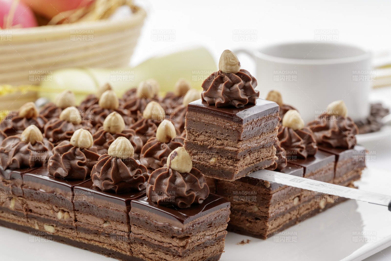 坚果巧克力慕斯蛋糕摆放在白色背景上