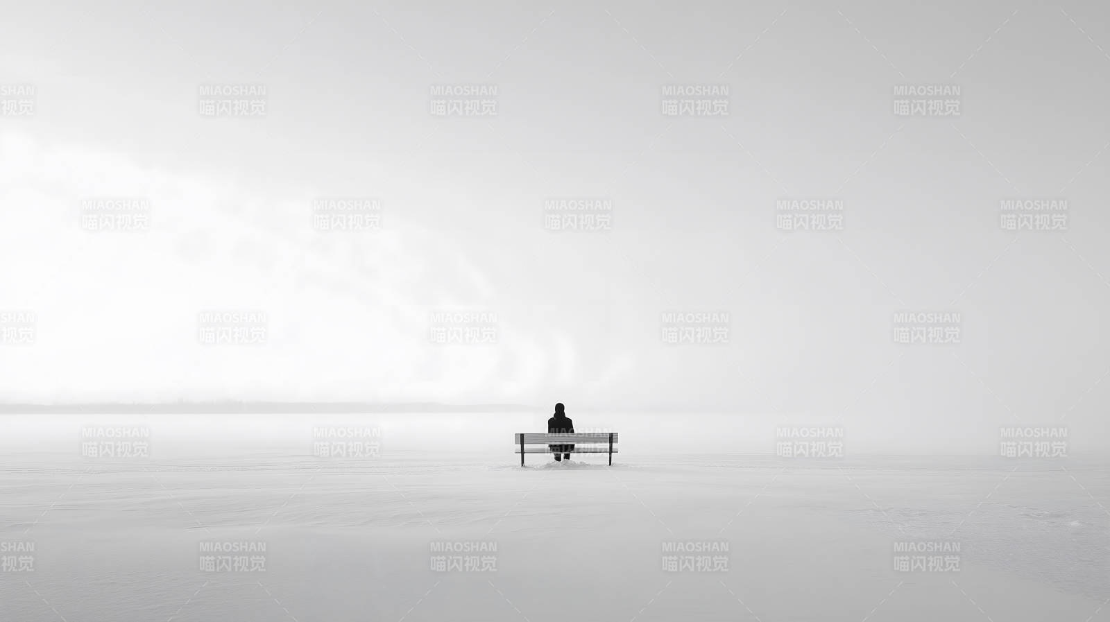 雪地長椅上的人影-圖片