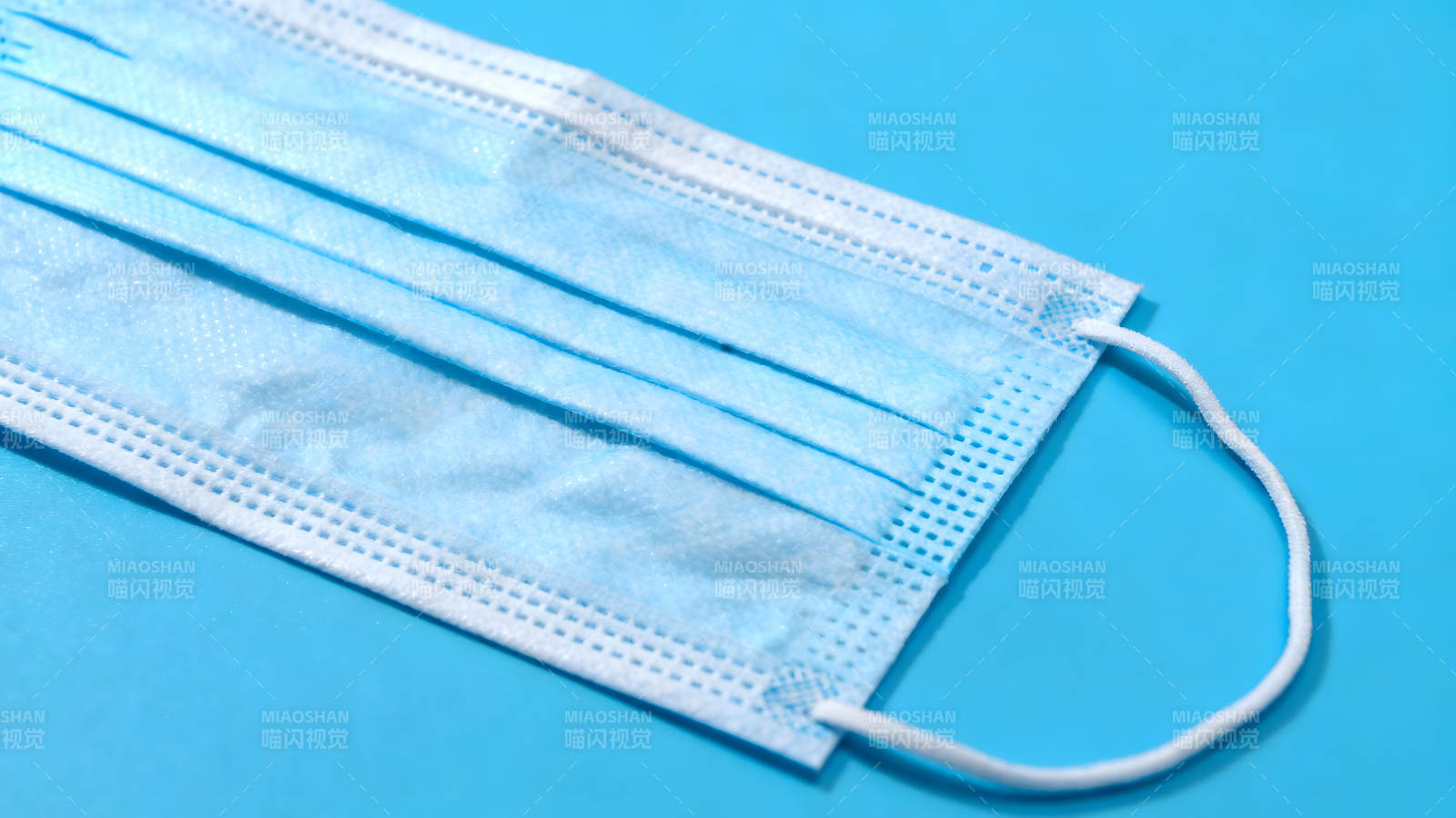蓝色口罩特写照片-图片