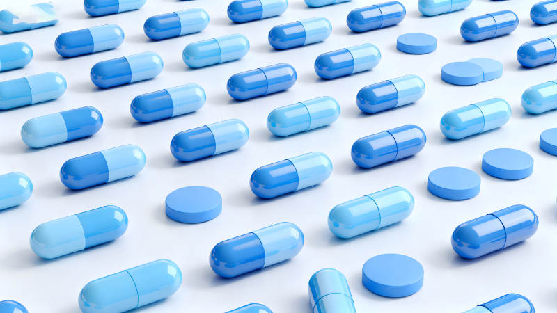 藍(lán)色藥丸排列特寫鏡頭圖片