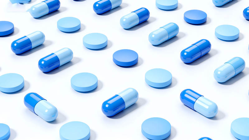 蓝色药丸胶囊排列设计-图片