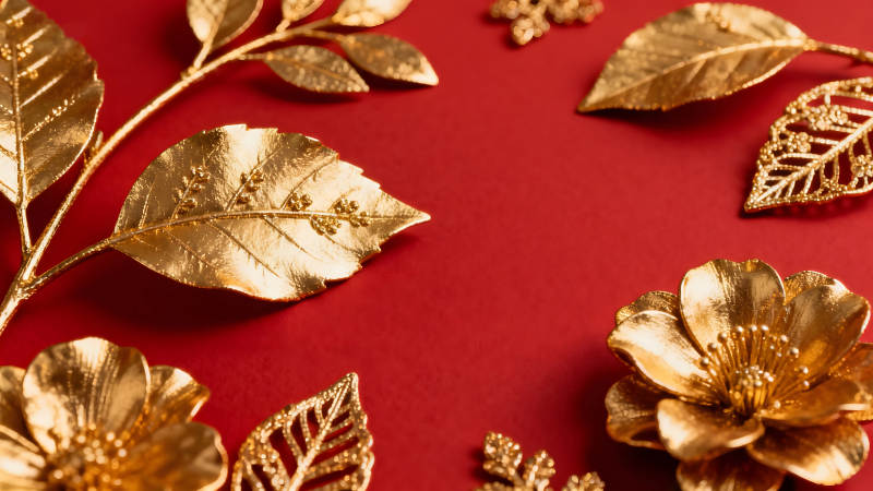 金色裝飾點綴紅色背景-圖片