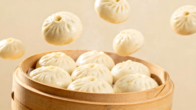 蒸籠里的包子和懸浮的包子-圖片