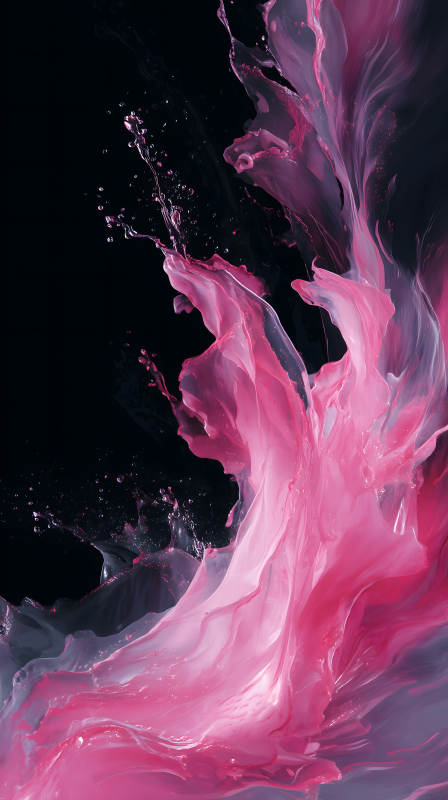 粉色液体飞溅在黑色背景中图片