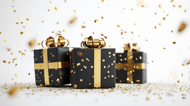 奢华黑色礼盒与金色飞屑图片