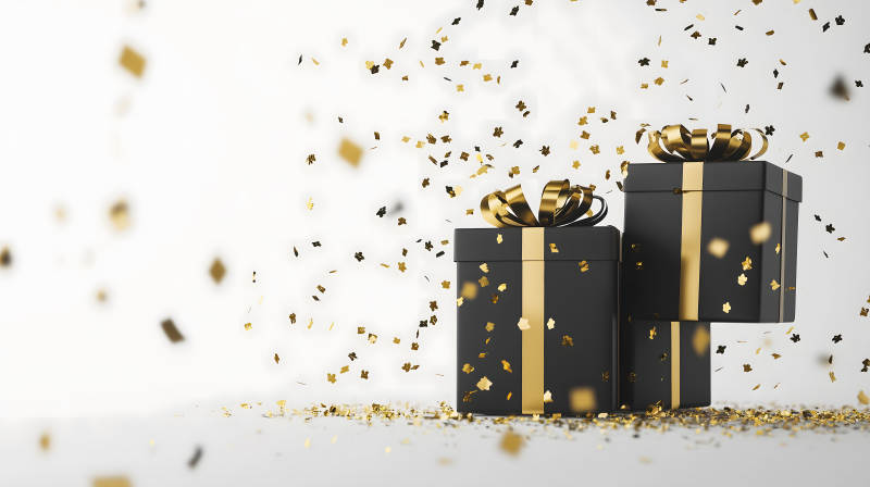 黑色礼盒与金色纸屑图片