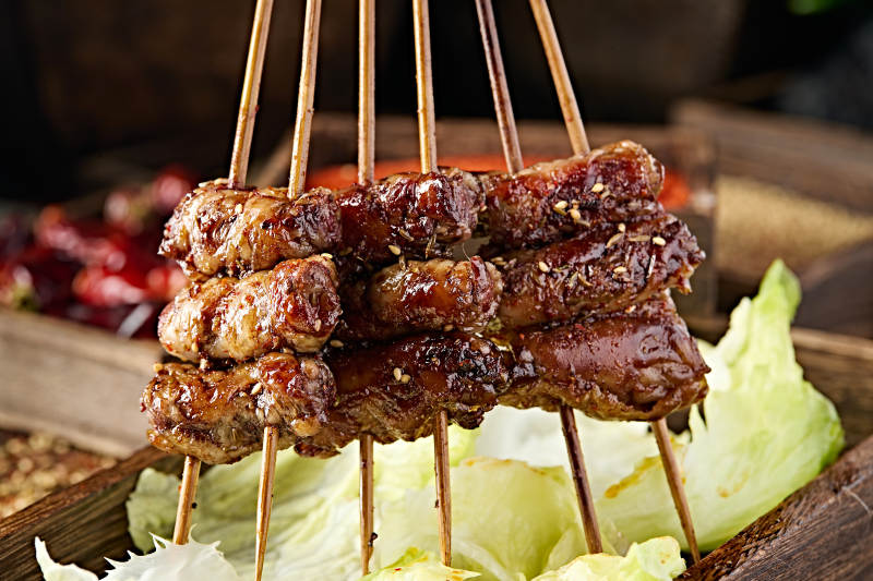 美味烧烤炭烤裹油羊肝图片