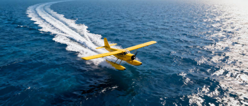 黄色飞机掠海飞行图片