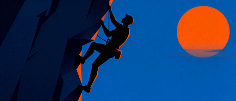 攀岩者与夕阳图片