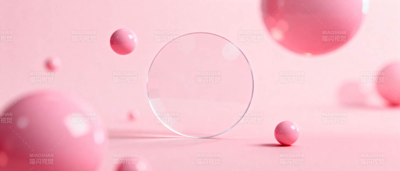粉色球体与透明圆环图片