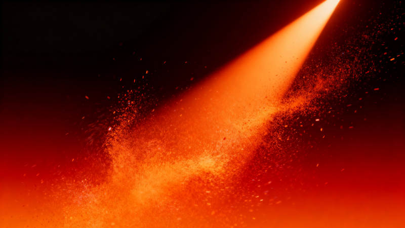 橙色光束与粒子效果图片