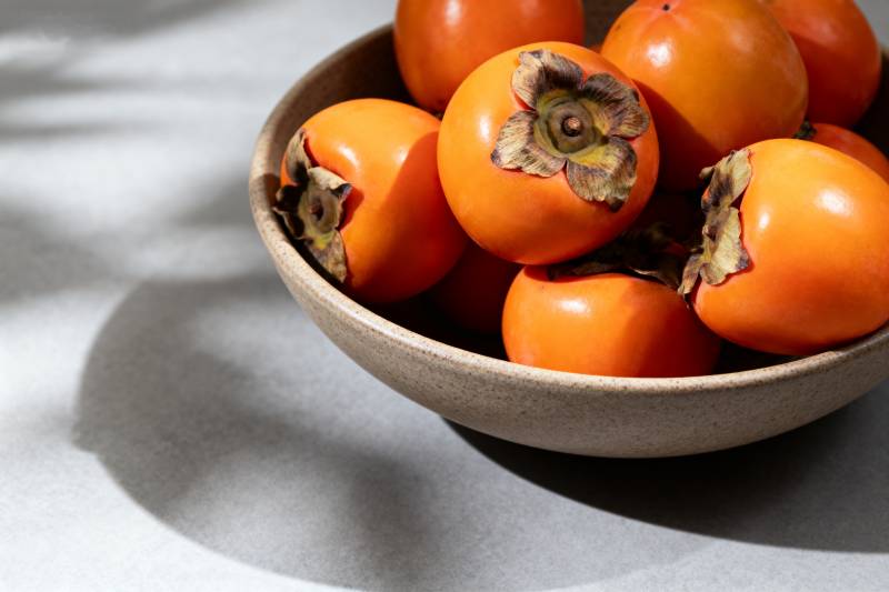 柿子满碗秋意浓图片