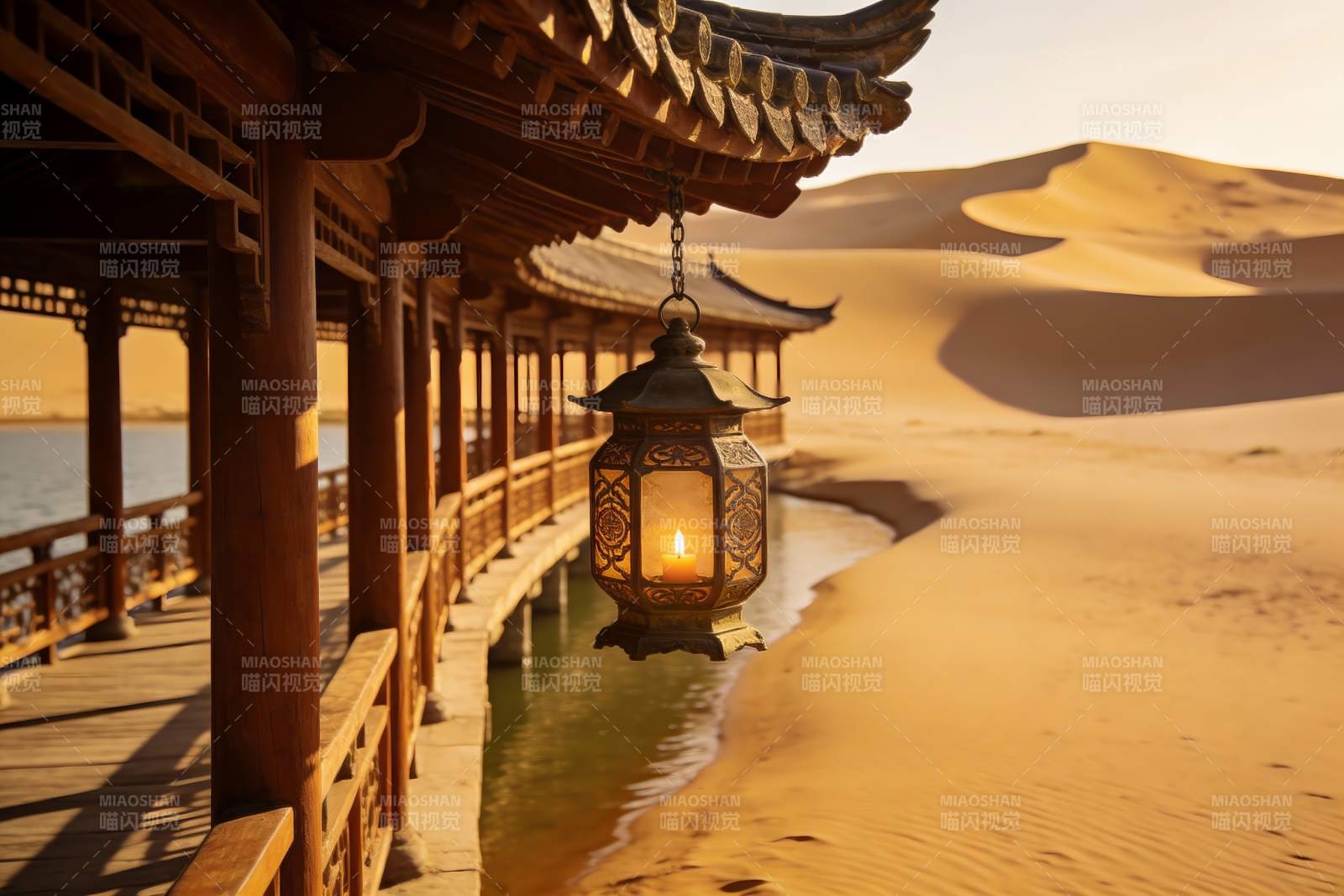 沙漠古亭夜灯映沙丘图片