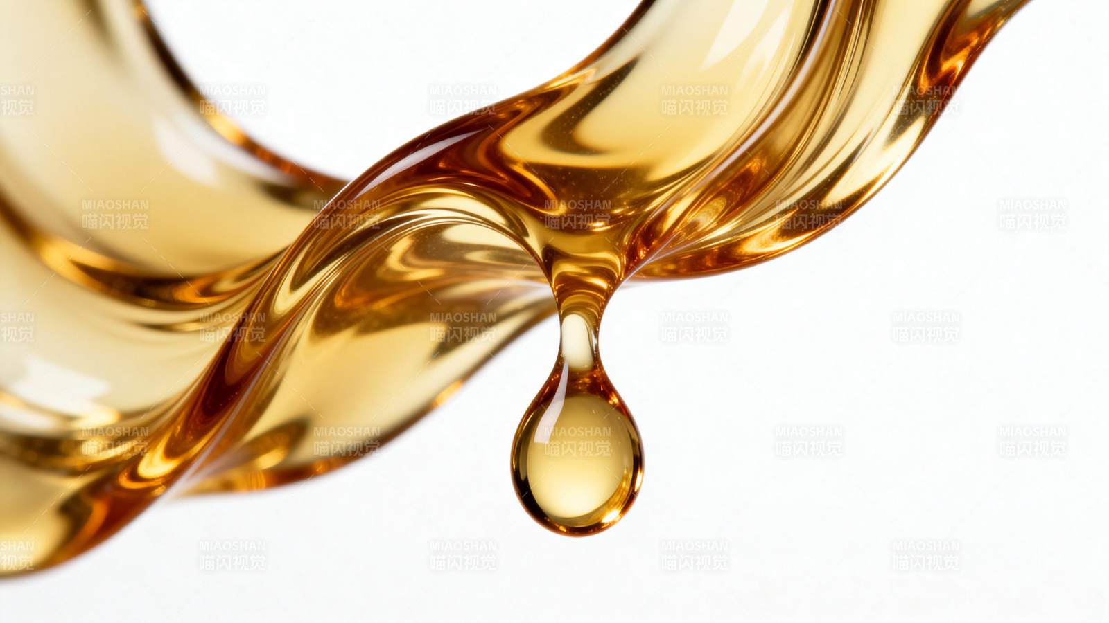 金色液体滴落瞬间图片